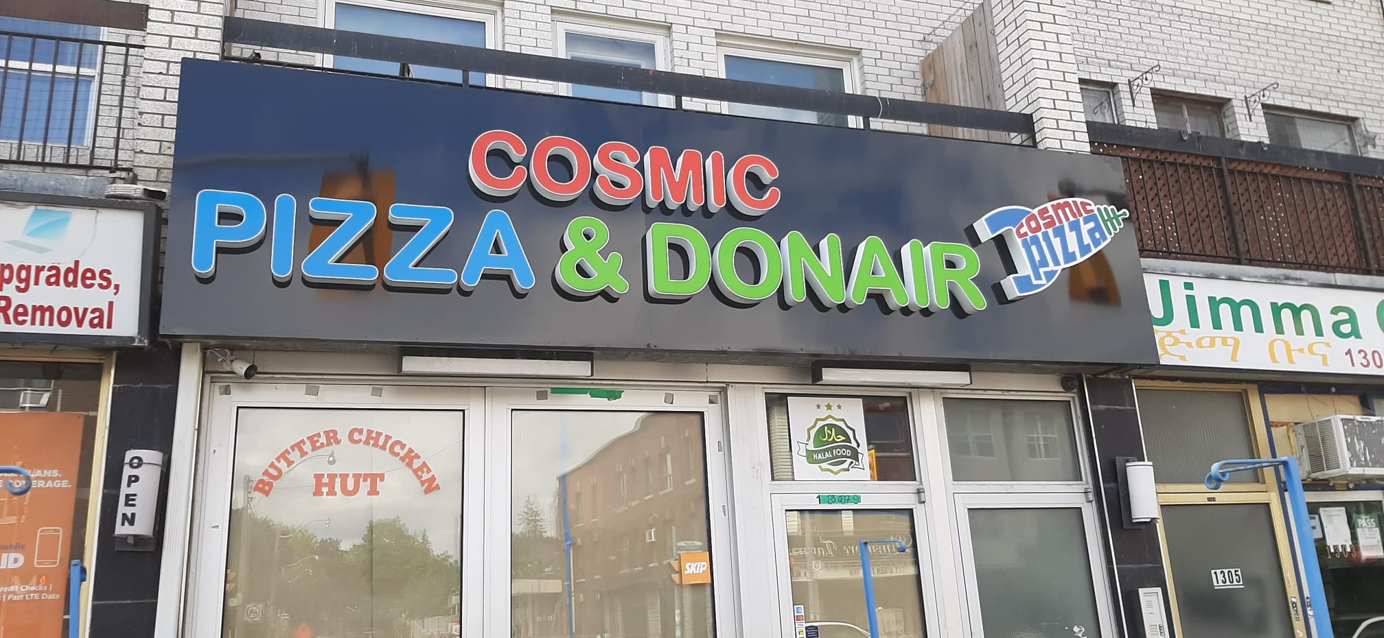 Cosmic Pizza and Donair storefront sign completed by Denton Design.