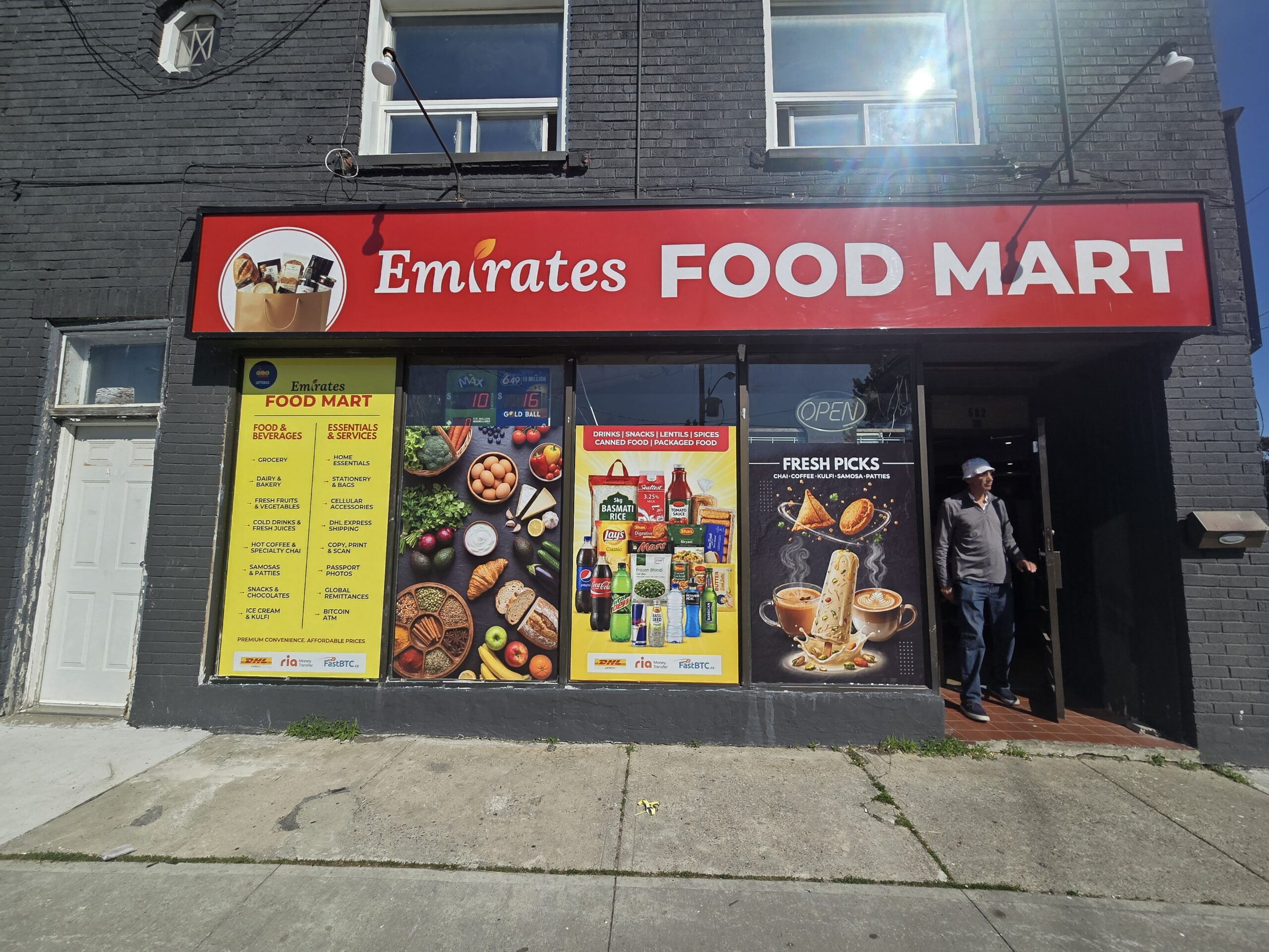 Emirates Food Mart storefront sign and window graphics by Denton Design.